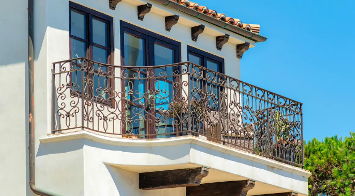 Mediterranean-style balcony under clear blue sky